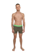 Olive green boxer briefs with bright neon green elastic waistband designed for performance yoga workouts
