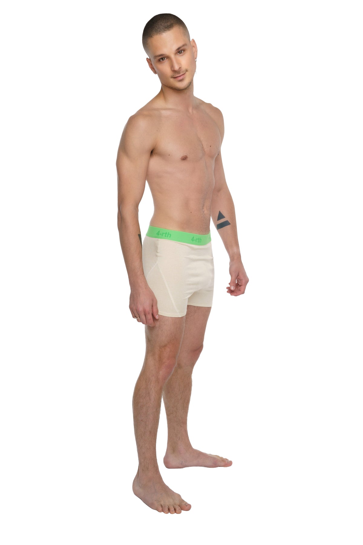 Cream-colored boxer briefs with bright green elastic waistband featuring brand logo for performance yoga leggings short sand beige
