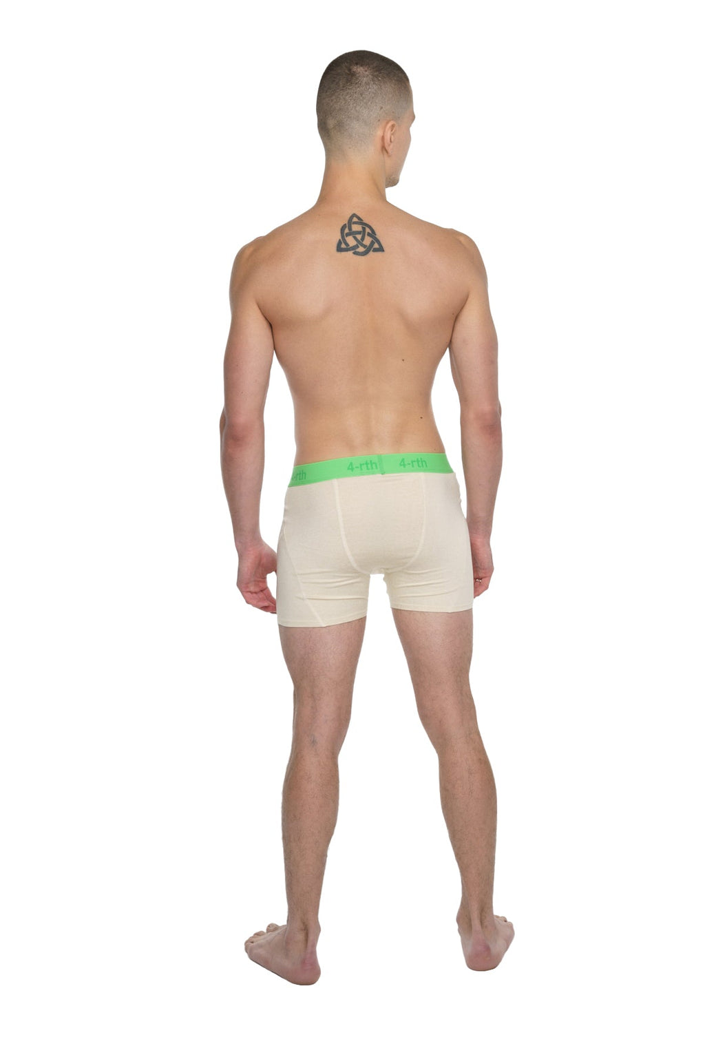 Cream-colored boxer briefs with bright green elastic waistband designed for performance yoga in sand beige shade