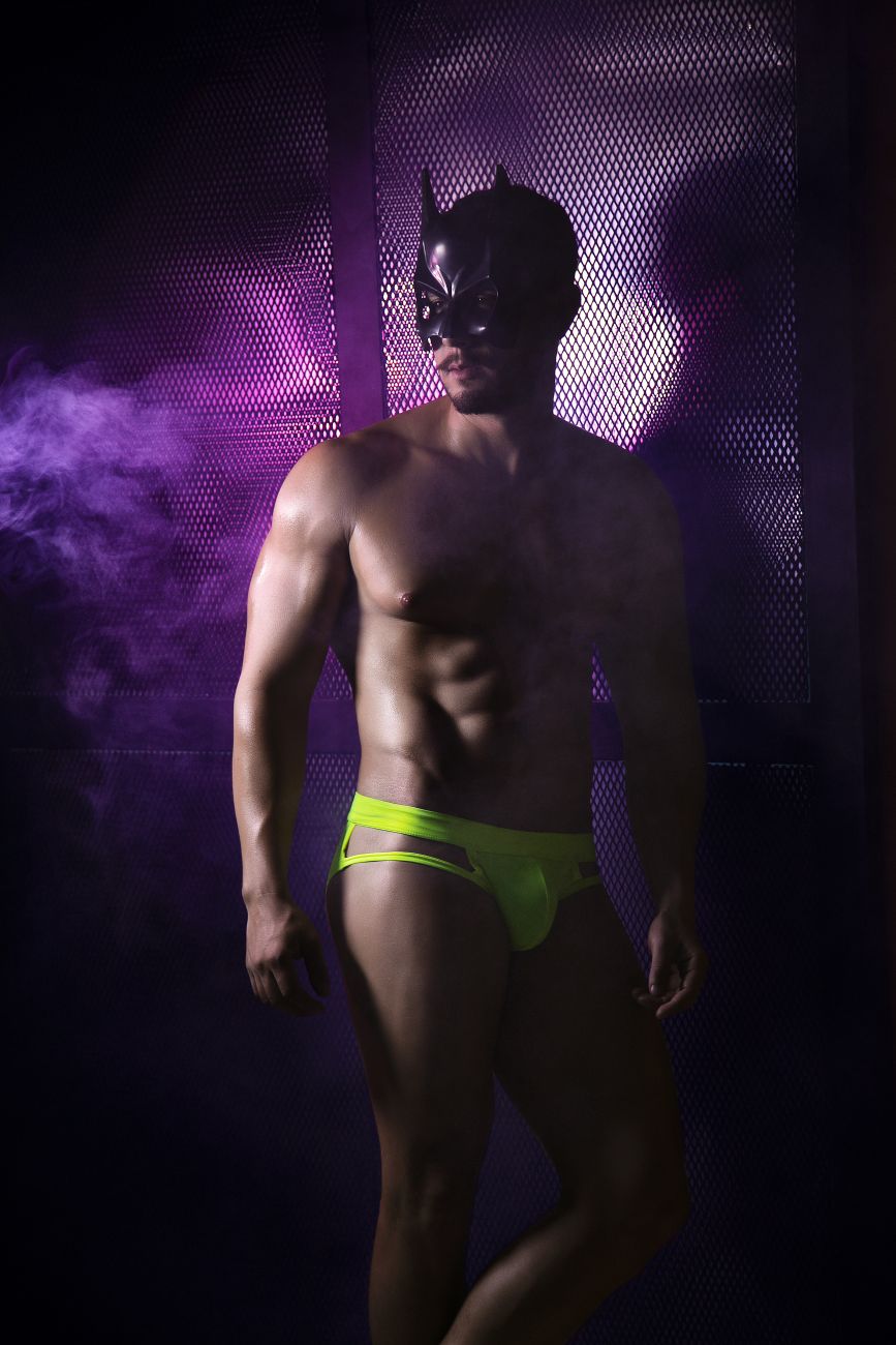 A man wearing a black batman mask models pikante pik 2114 lenox neon green briefs in a front view