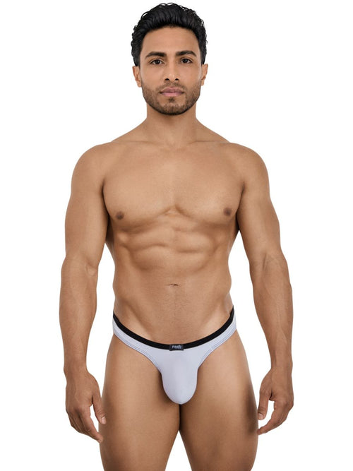 Model wearing a sleek gray Pikante Isis men's thong with a thin black waistband.