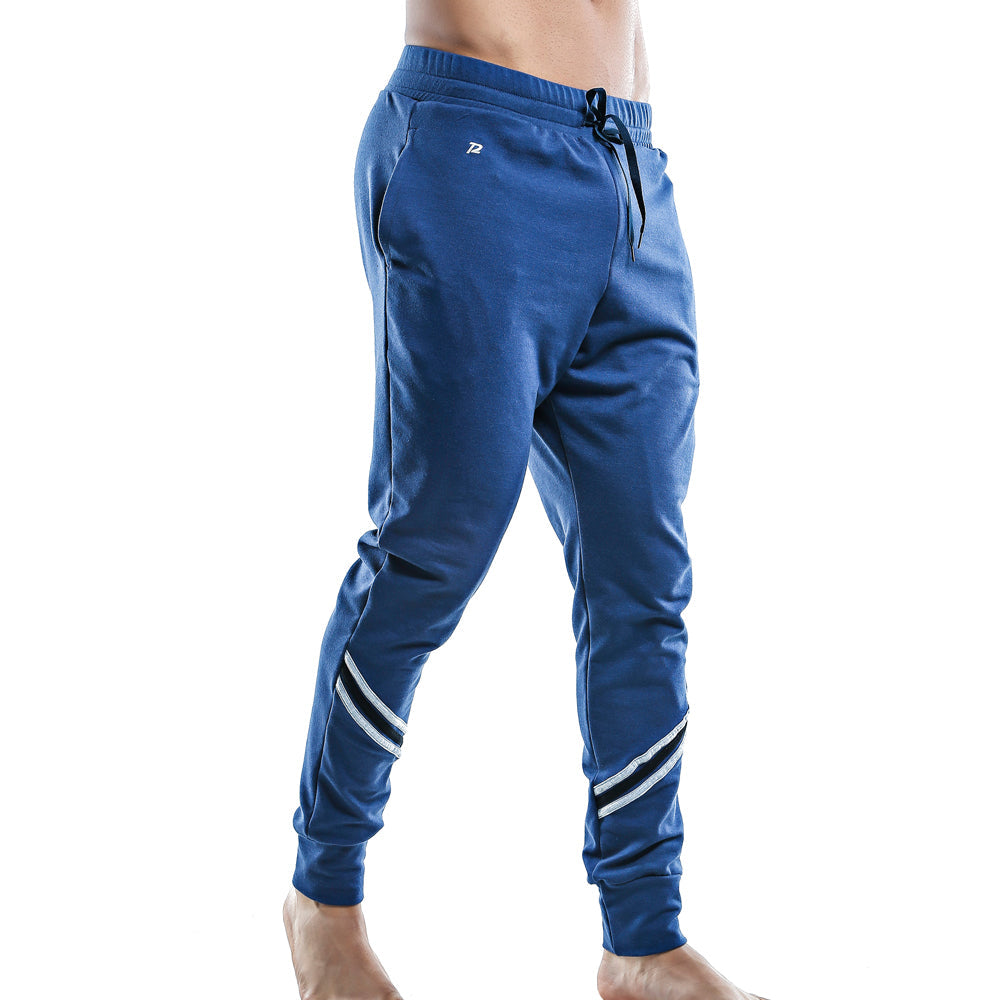 Blue pistol pete PPD005 athletic joggers with white diagonal stripes on lower legs and logo on thigh