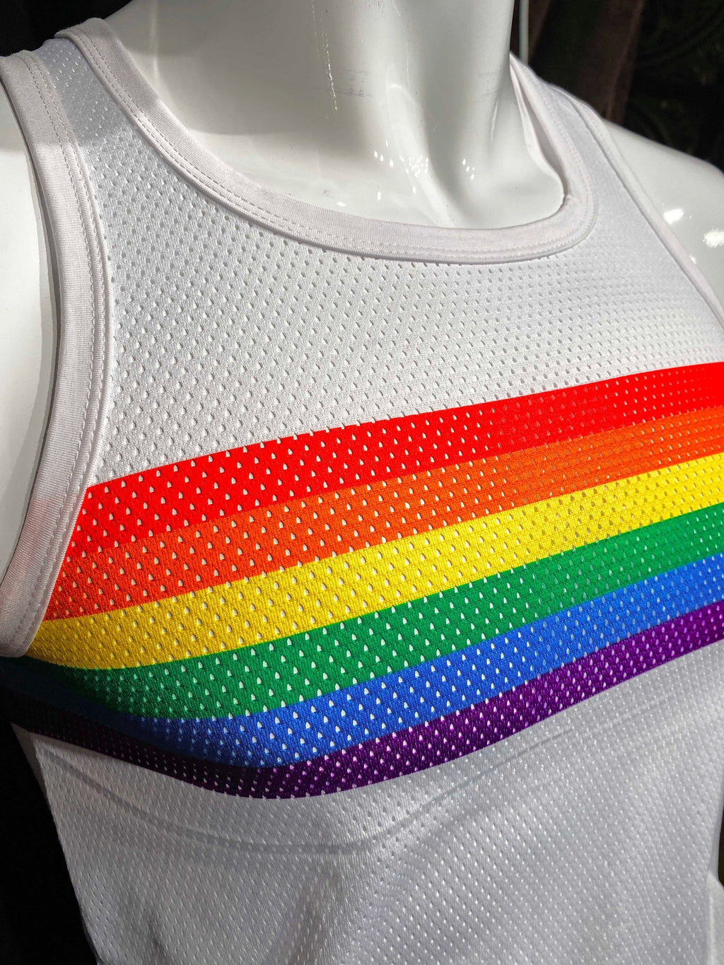 White mesh tank top with vibrant rainbow chest stripe designed for casual summer wear