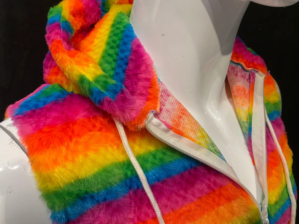 Rainbow stripe faux fur hoodie featuring vibrant plush material and white drawstrings with fuzzy hooded vest style