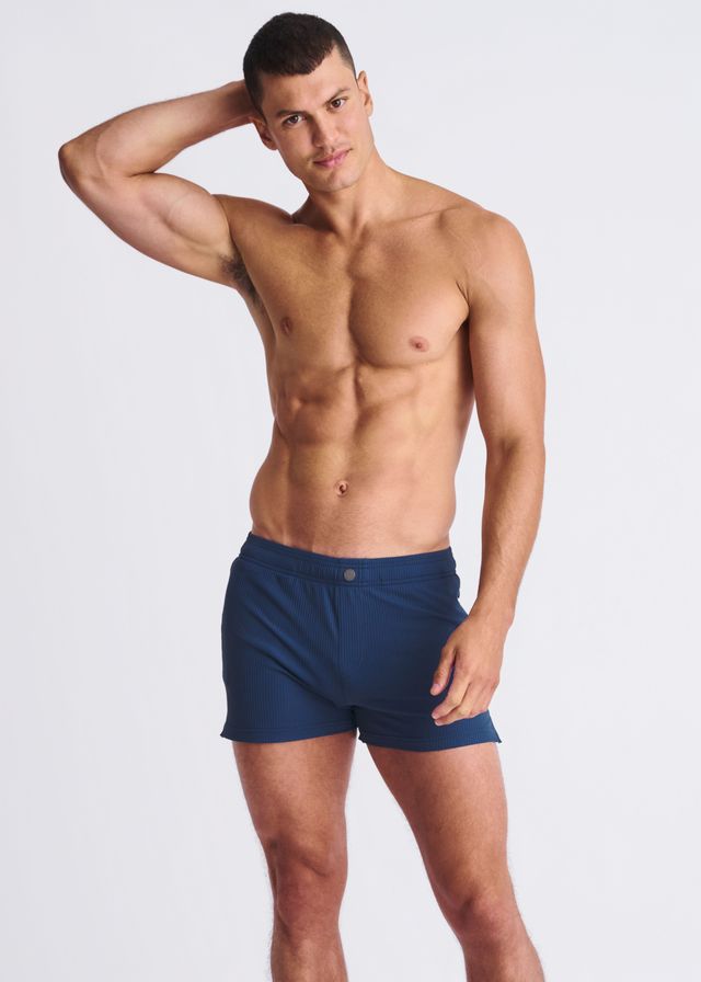 Navy blue Riviera seersucker swim shorts with mesh lining and single button closure at the waistband