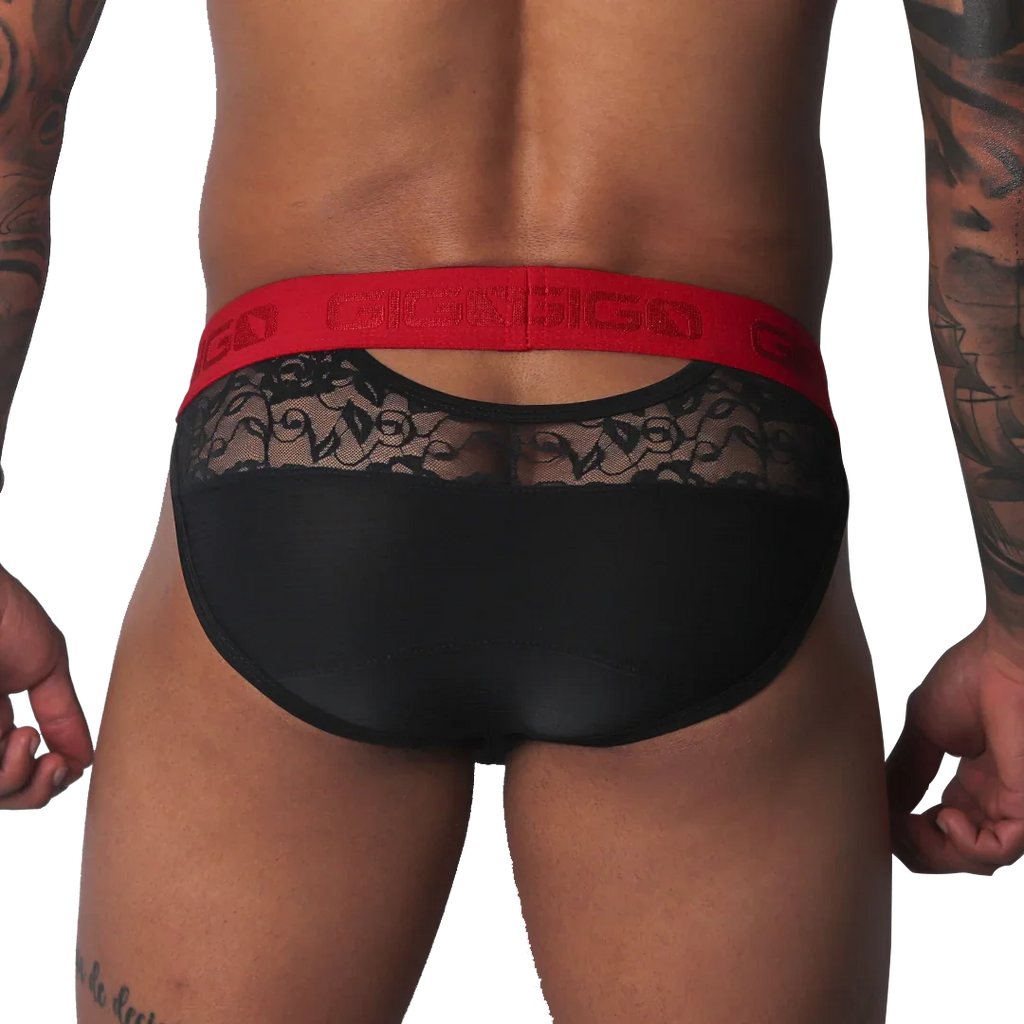 Black brief with sheer floral lace upper panel, solid black lower section, and a bold red branded elastic waistband.