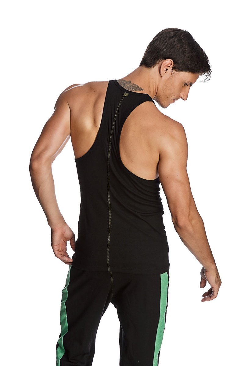 Back view of black racer-back yoga tank with central zipper paired with black pants featuring green side stripes