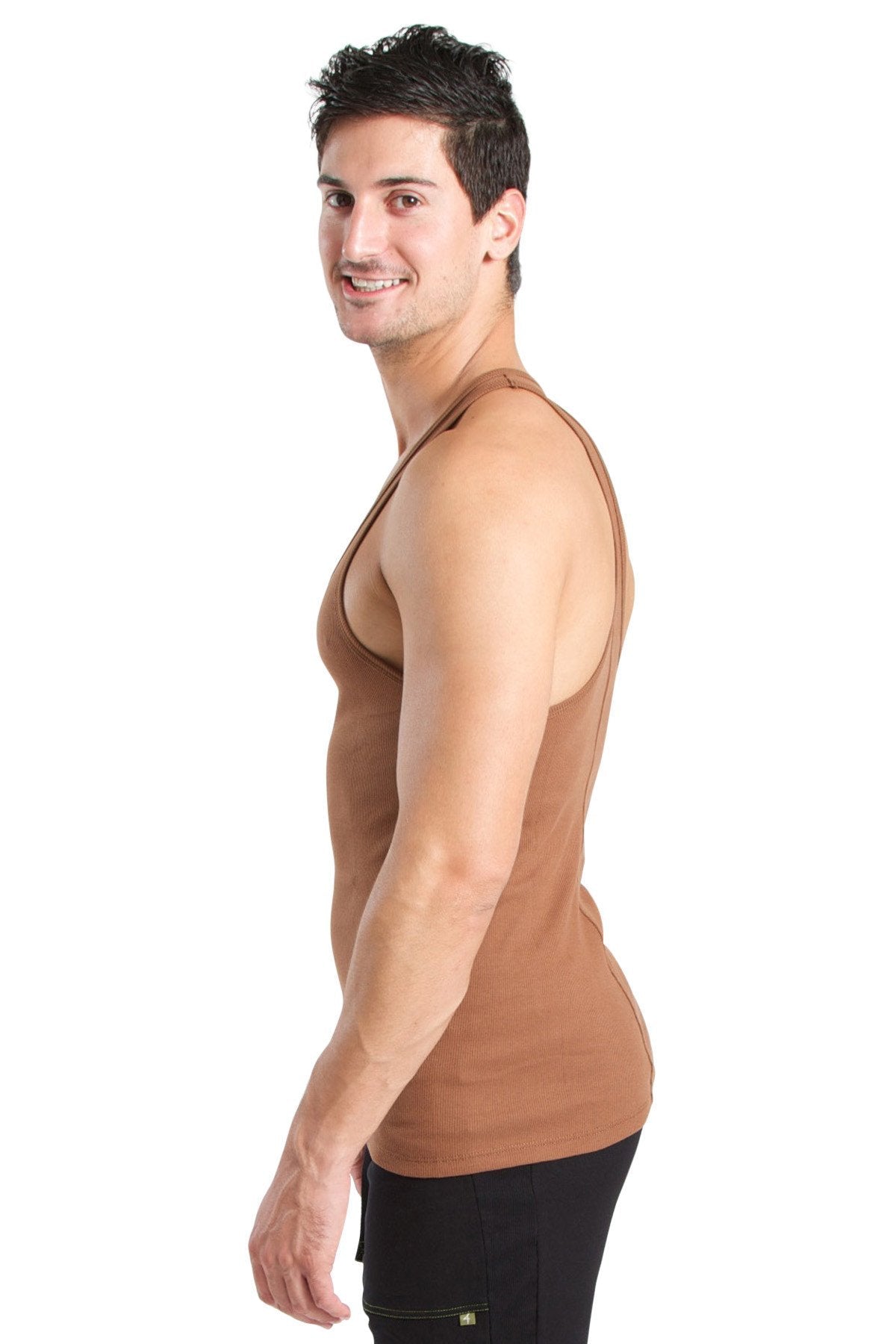A man wearing a fitted tan racer-back yoga tank top made of breathable fabric for comfortable workouts