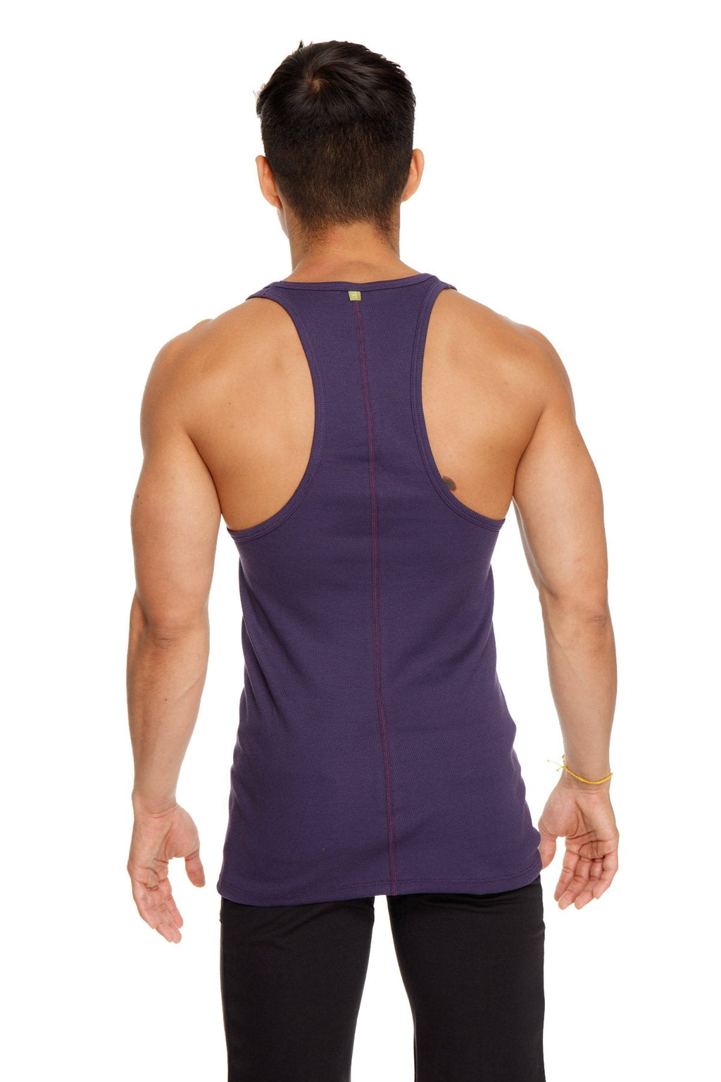 A deep purple racer-back yoga tank with a form-fitting design and subtle vertical seam detailing