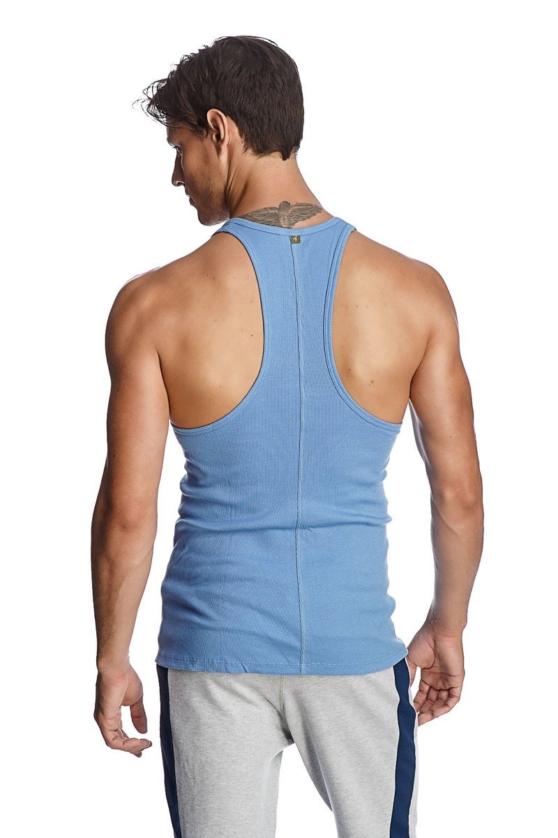 Light blue ribbed cotton racer-back yoga tank with racerback design and small green logo at the neckline
