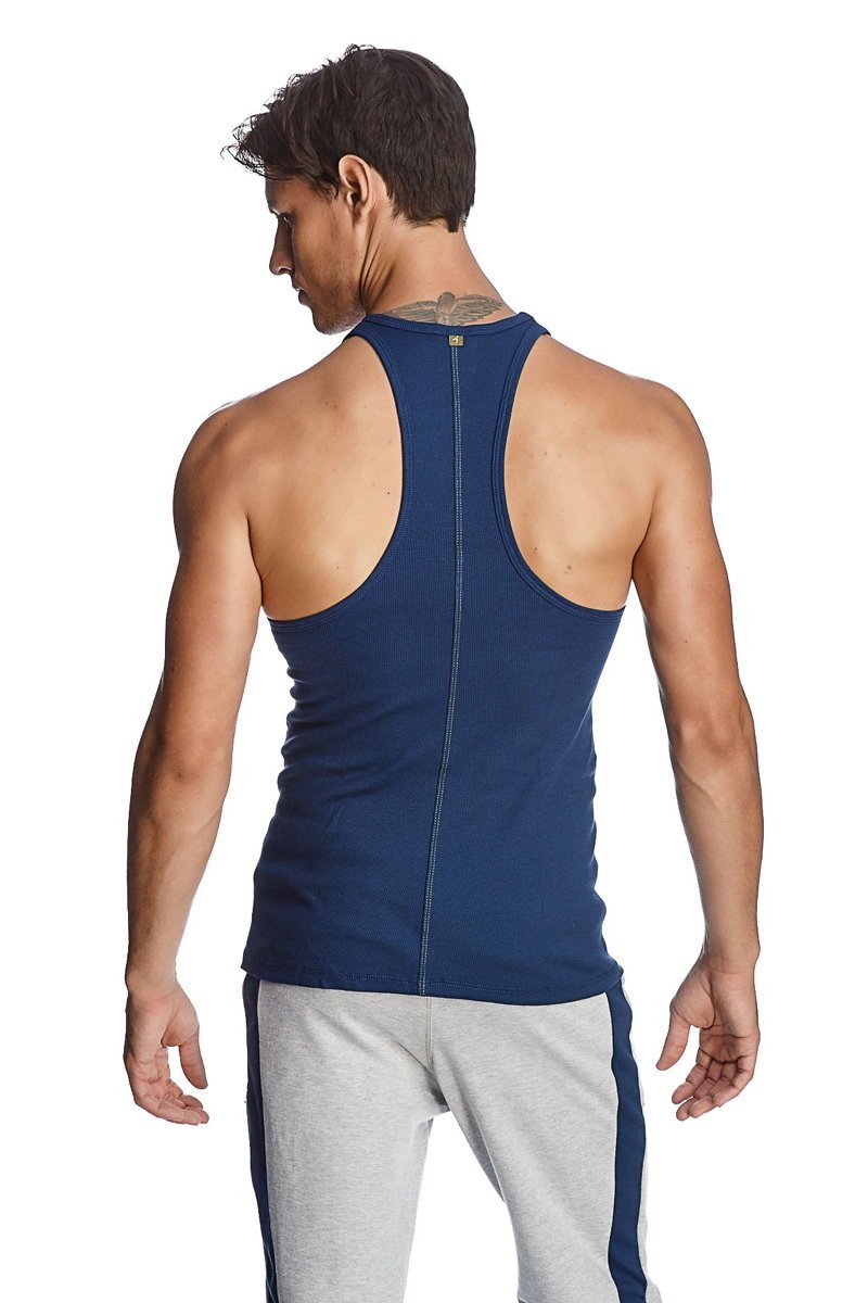 Navy blue racer-back yoga tank made of breathable fabric with central back zipper for easy wear and style