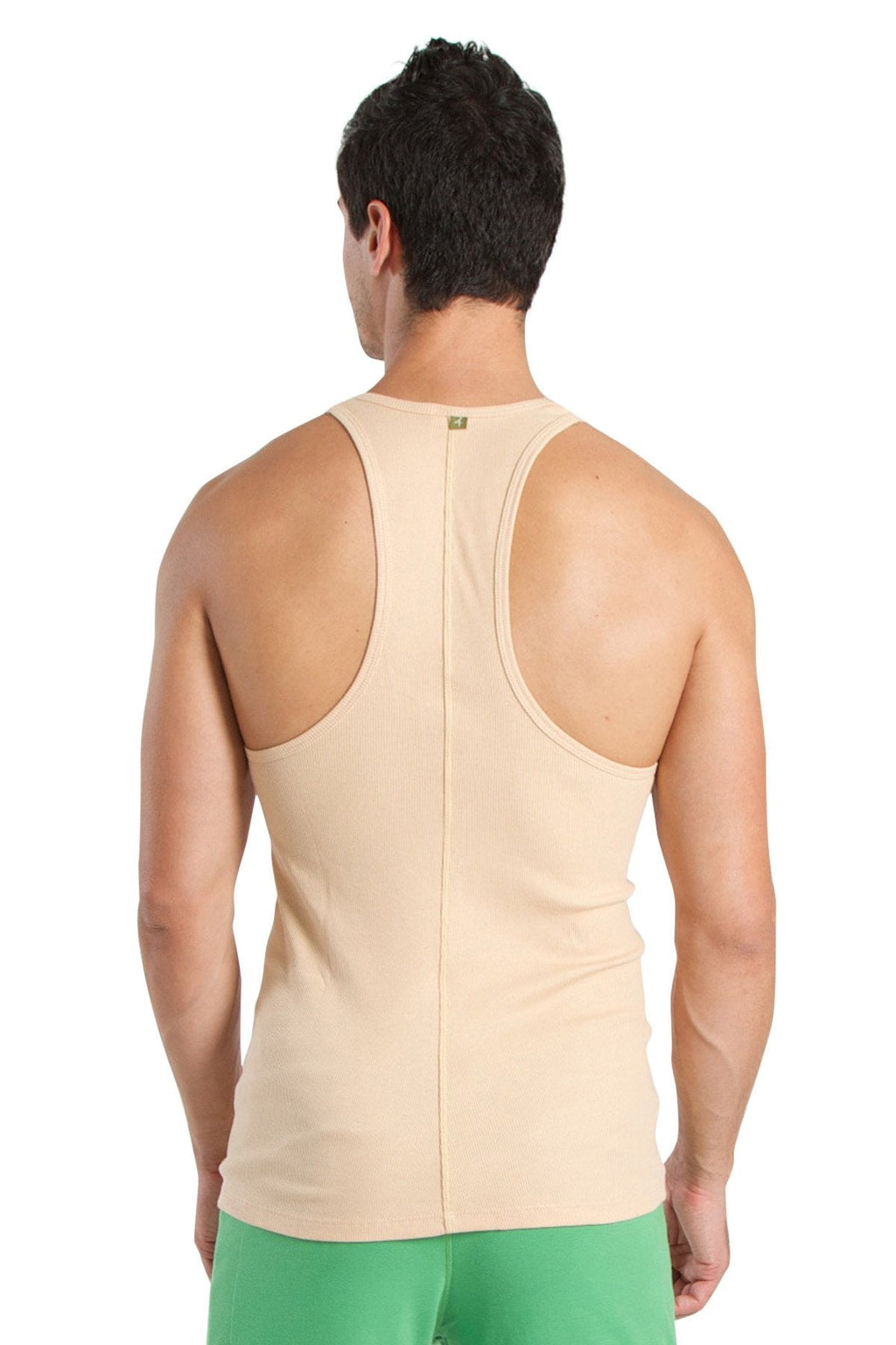 Beige racer-back yoga tank with central seam and subtle brand tag at neckline for activewear use