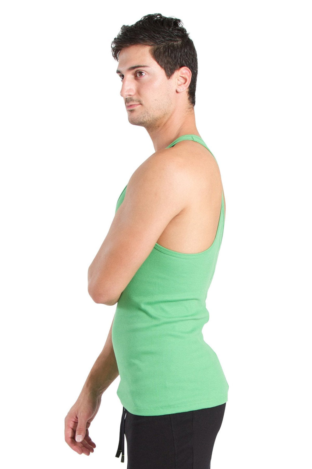 A man wearing a bamboo green racerback yoga tank top with thin straps and a fitted cut