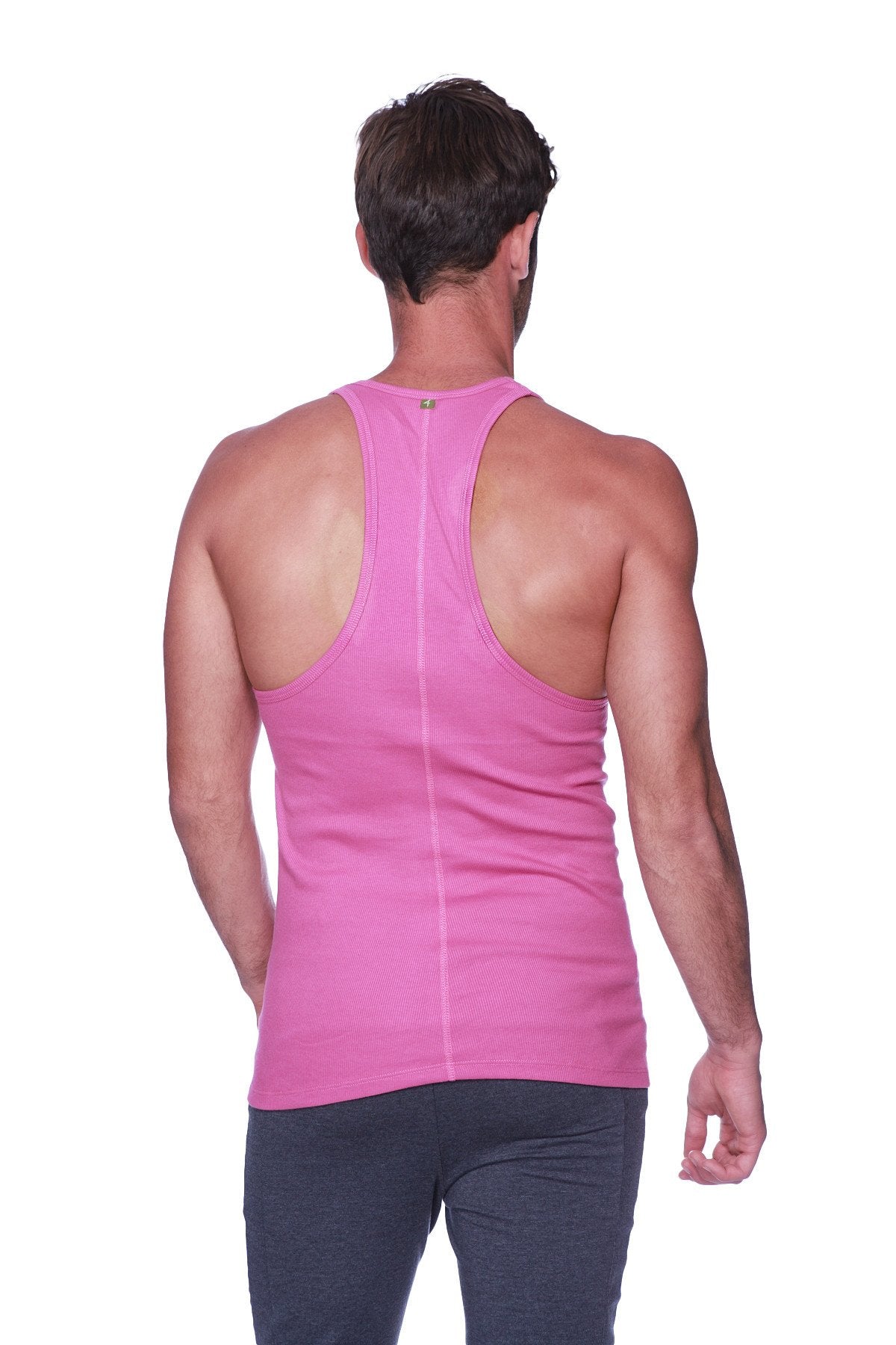 A vibrant berry pink form-fitting racerback yoga tank top with a subtle vertical seam down the center