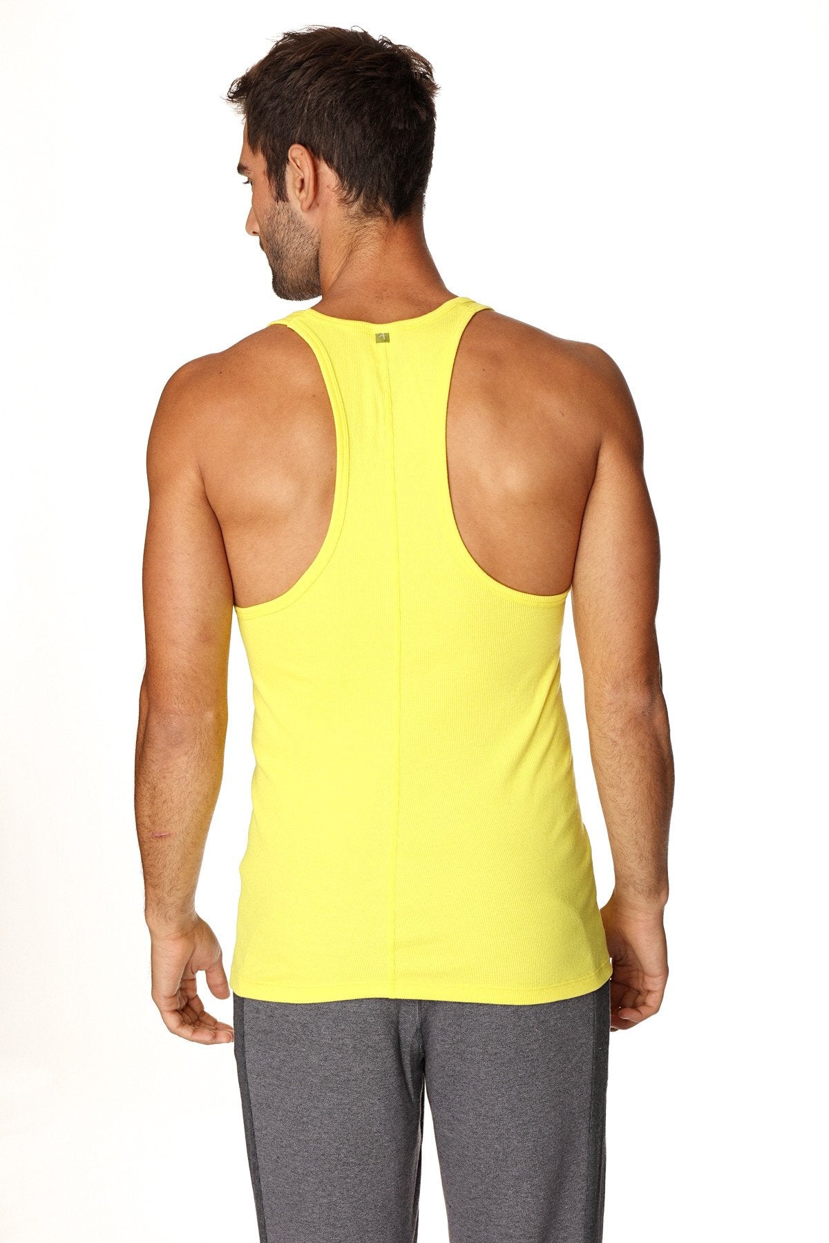 Bright yellow racerback yoga tank top with sleek form-fitting design for comfortable workout wear