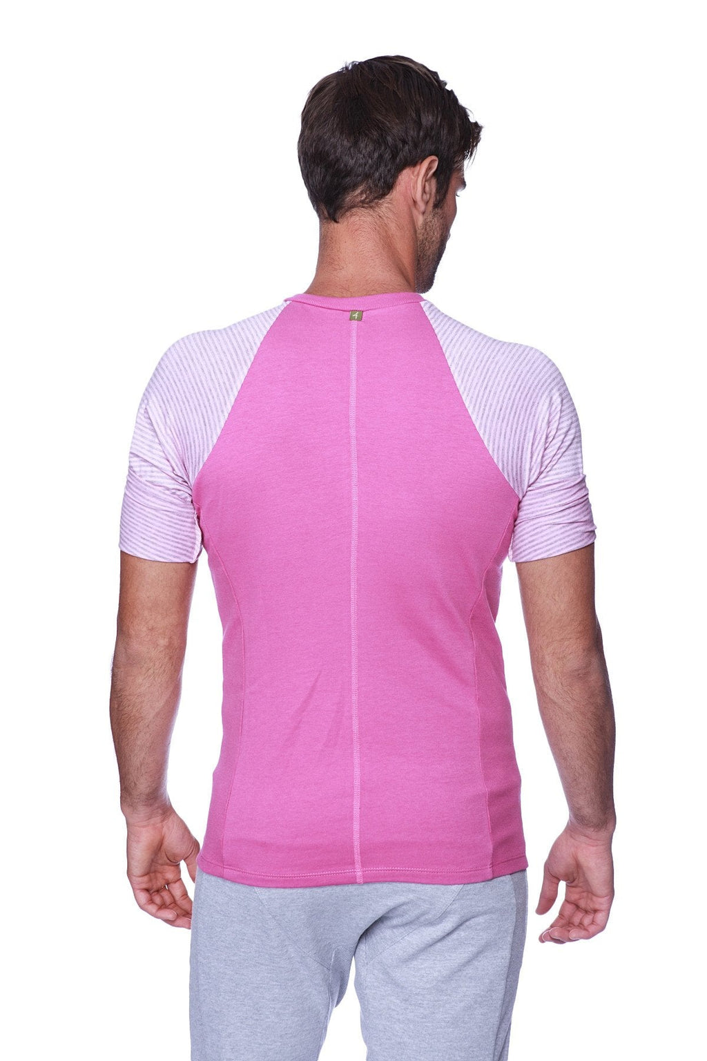 Pink athletic raglan sleeve crew neck shirt with light gray and white striped shoulders for activewear
