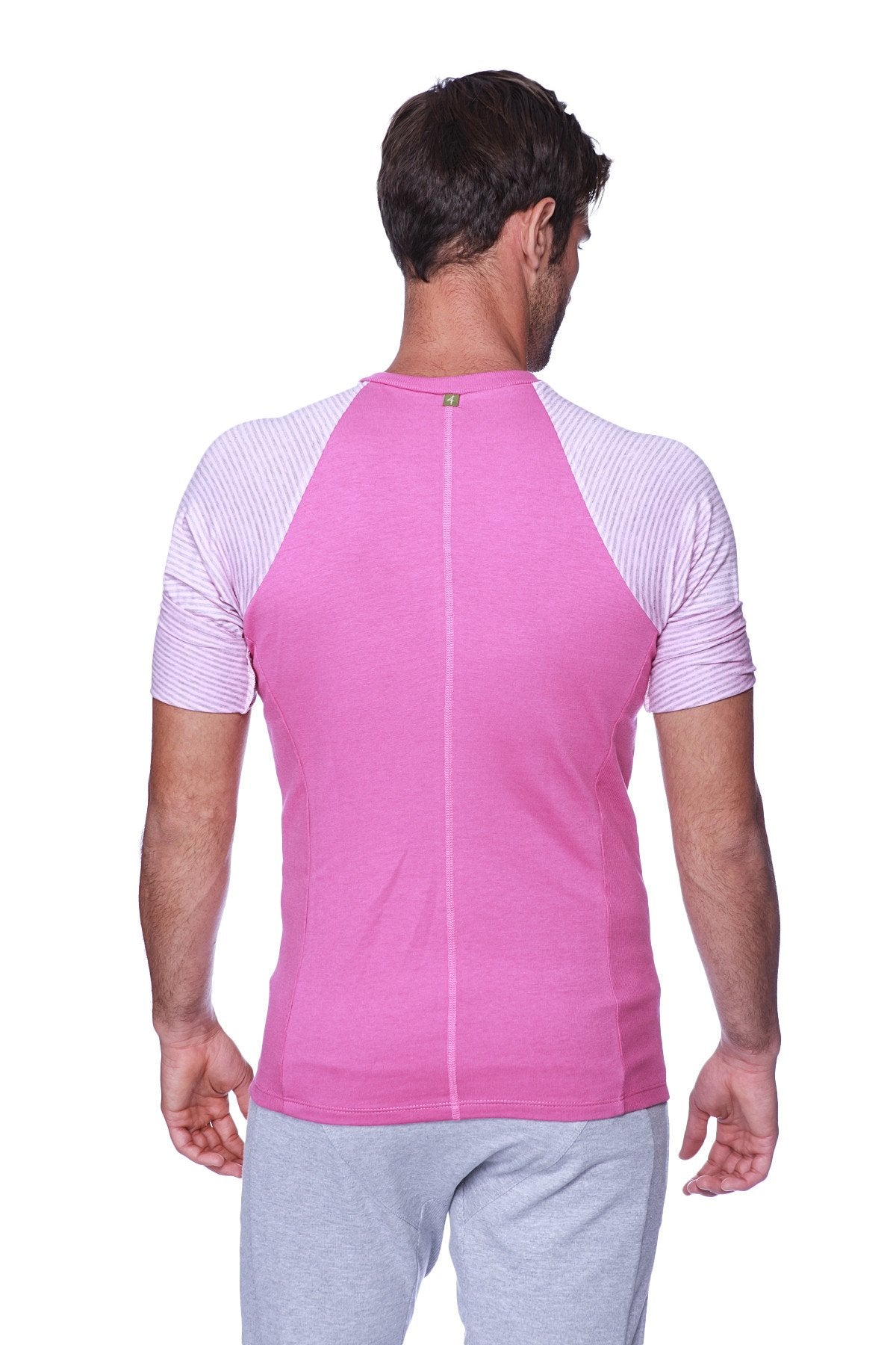 Pink athletic raglan sleeve crew neck shirt with light gray and white striped shoulders for activewear