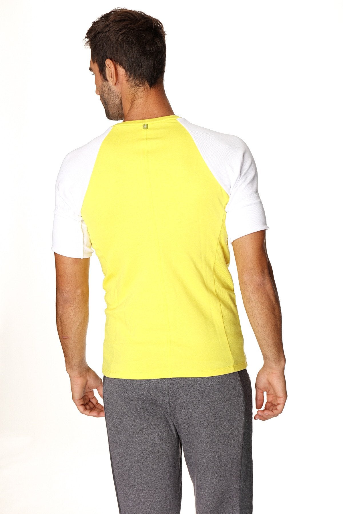 Bright yellow and white raglan sleeved athletic t-shirt with crew neck designed for active use