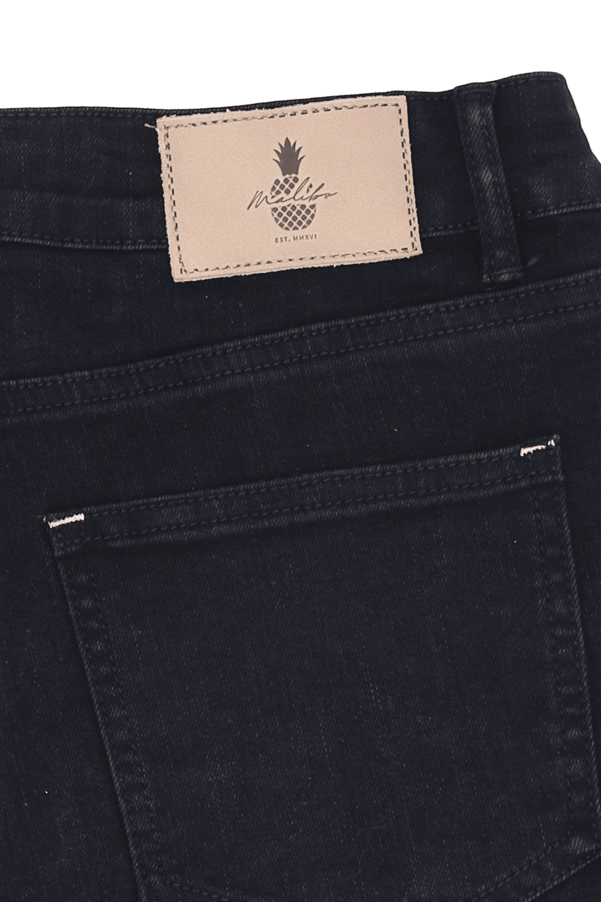 Black denim rockstar raw cut 2.5 inch short shorts with beige leather patch featuring pineapple logo on back waistband