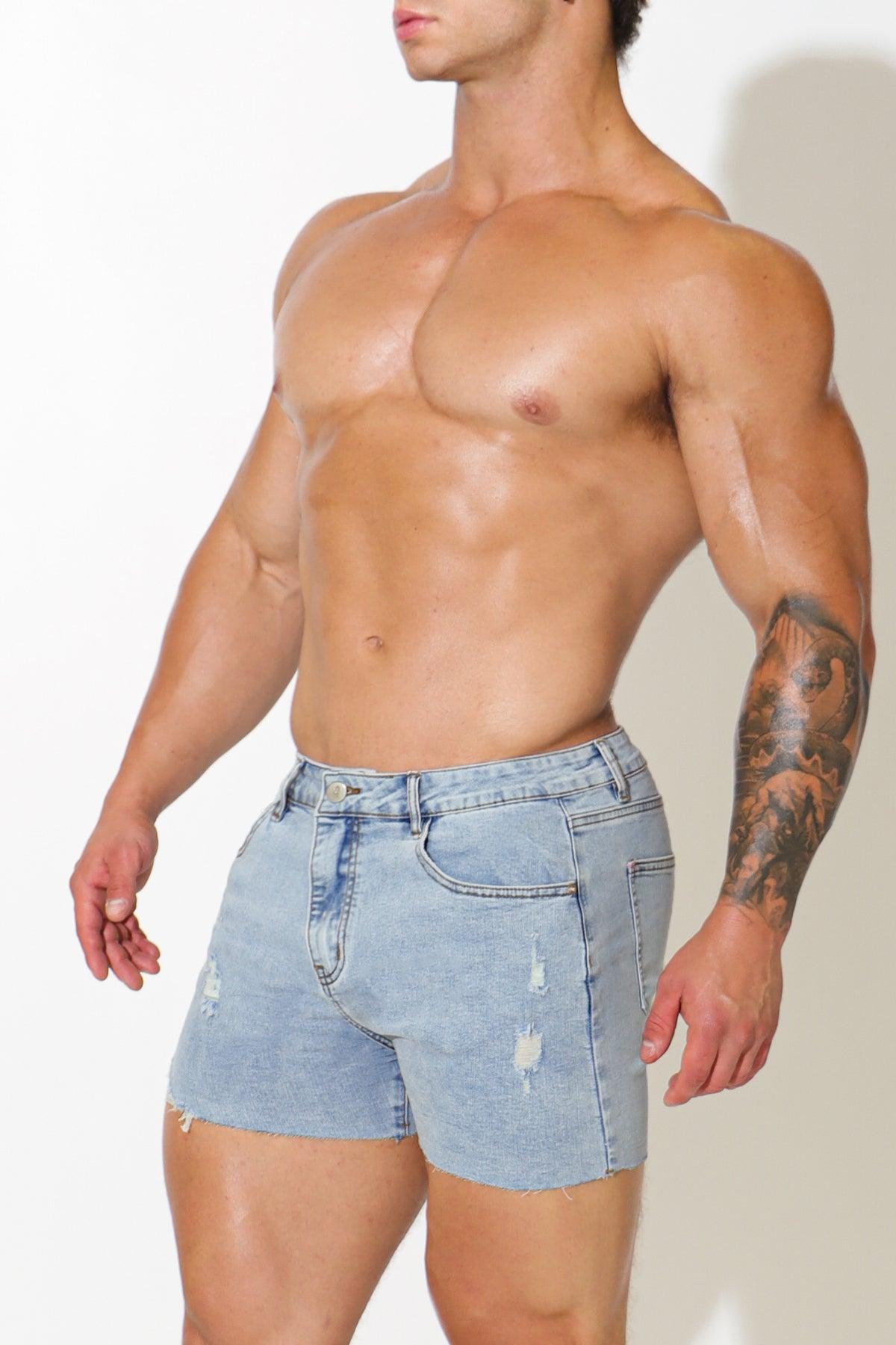 Rockstar raw cut 2.5 inch light-wash denim short shorts with distressed details and frayed hem in capri blue