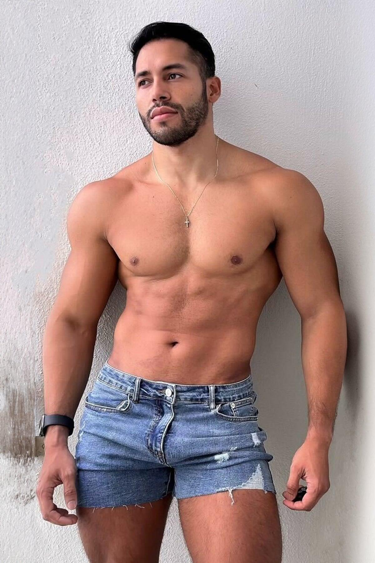 Rockstar raw cut 2.5 inch washed blue denim short shorts with frayed hem and distressed details