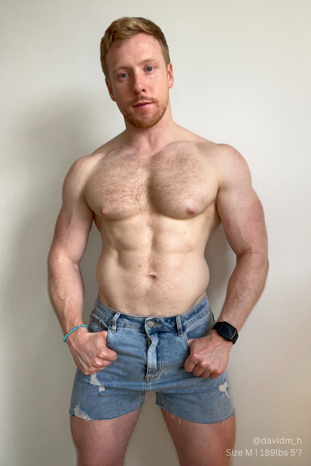Rockstar raw cut 2.5 inch denim short shorts in washed blue with distressed details and classic five-pocket design
