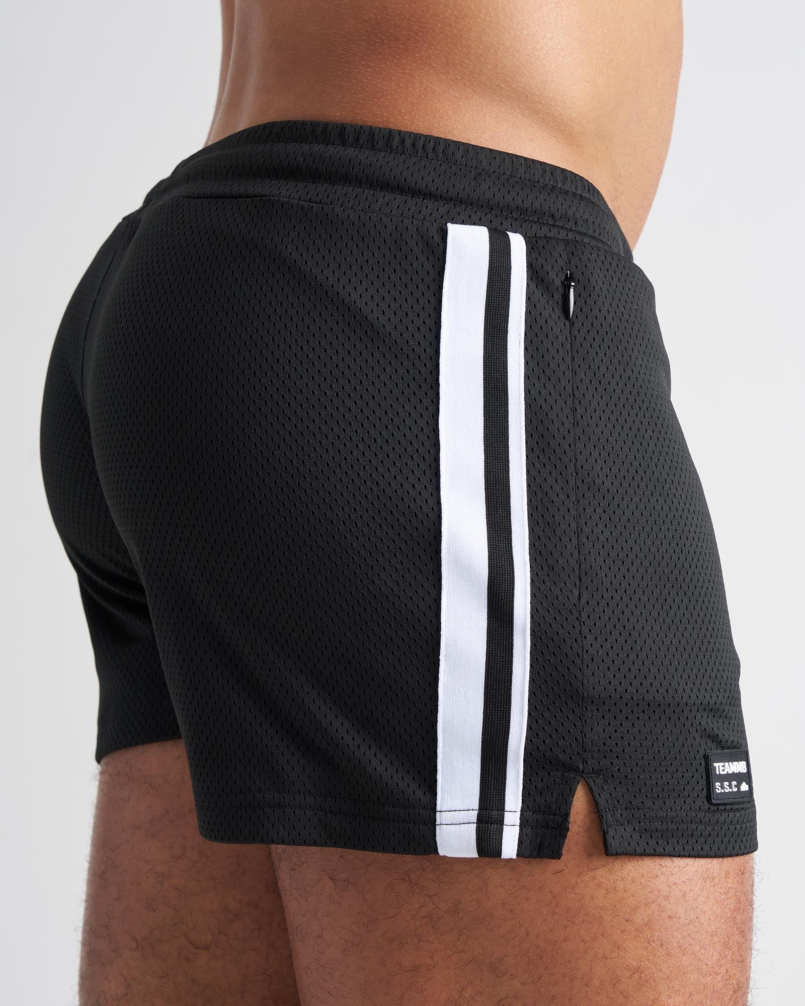 Black mesh s.s.c. fraternity 3 inch athletic shorts with two white stripes and a small brand tag on the lower right leg