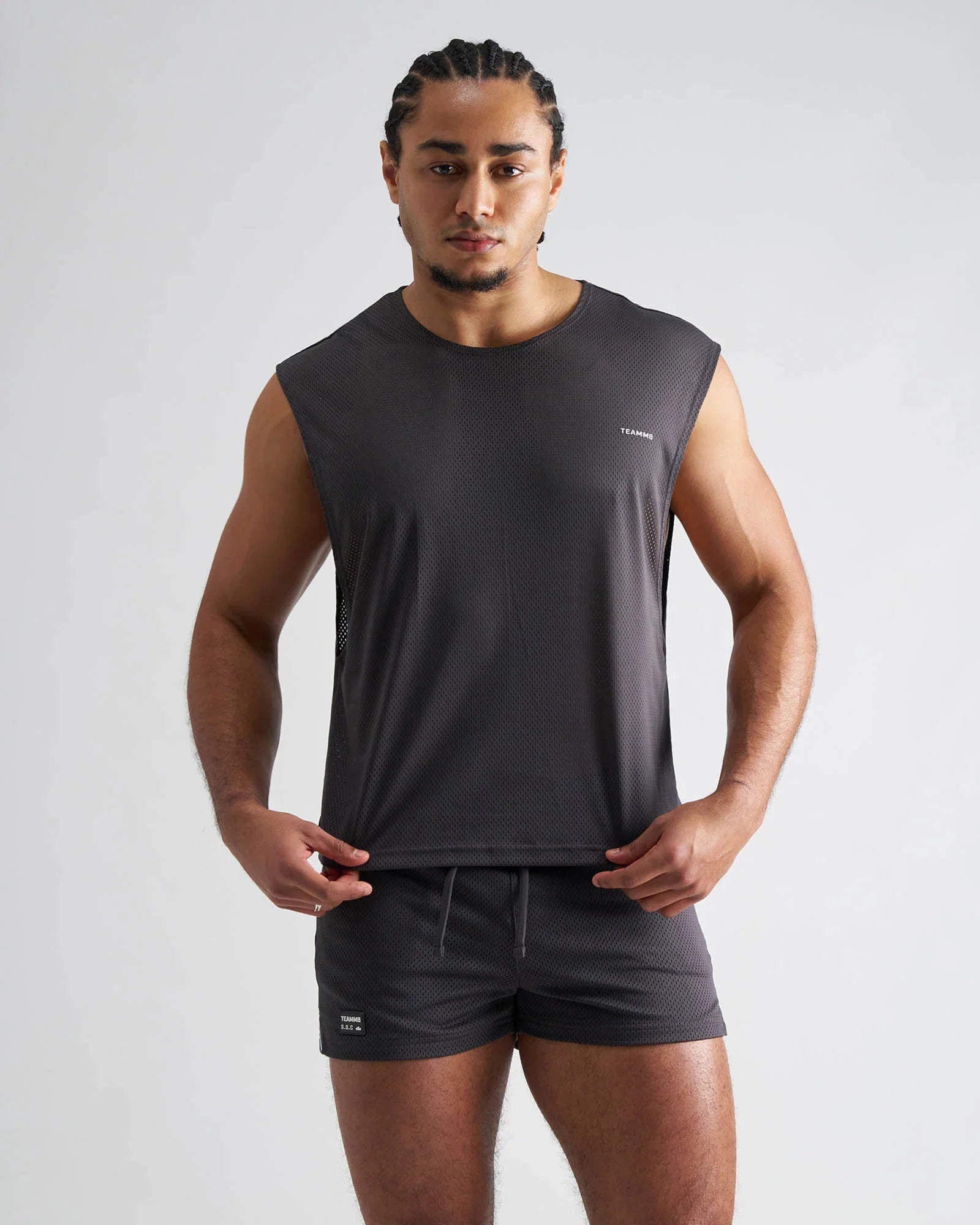 Dark gray sleeveless S.S.C. mesh muscle tank with textured mesh fabric and subtle chest branding