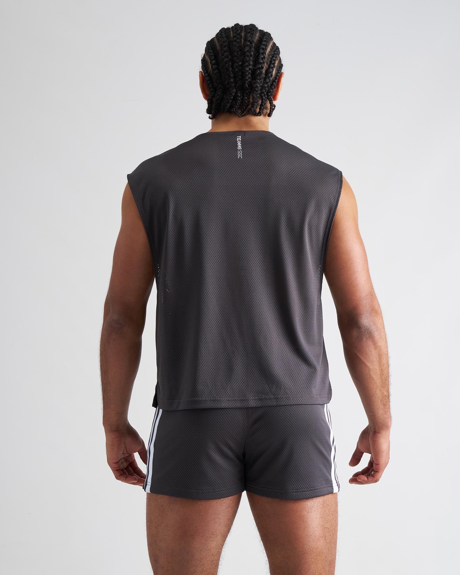 Dark gray mesh sleeveless s.s.c. muscle tank showing back side with a subtle vertical logo for athletic use