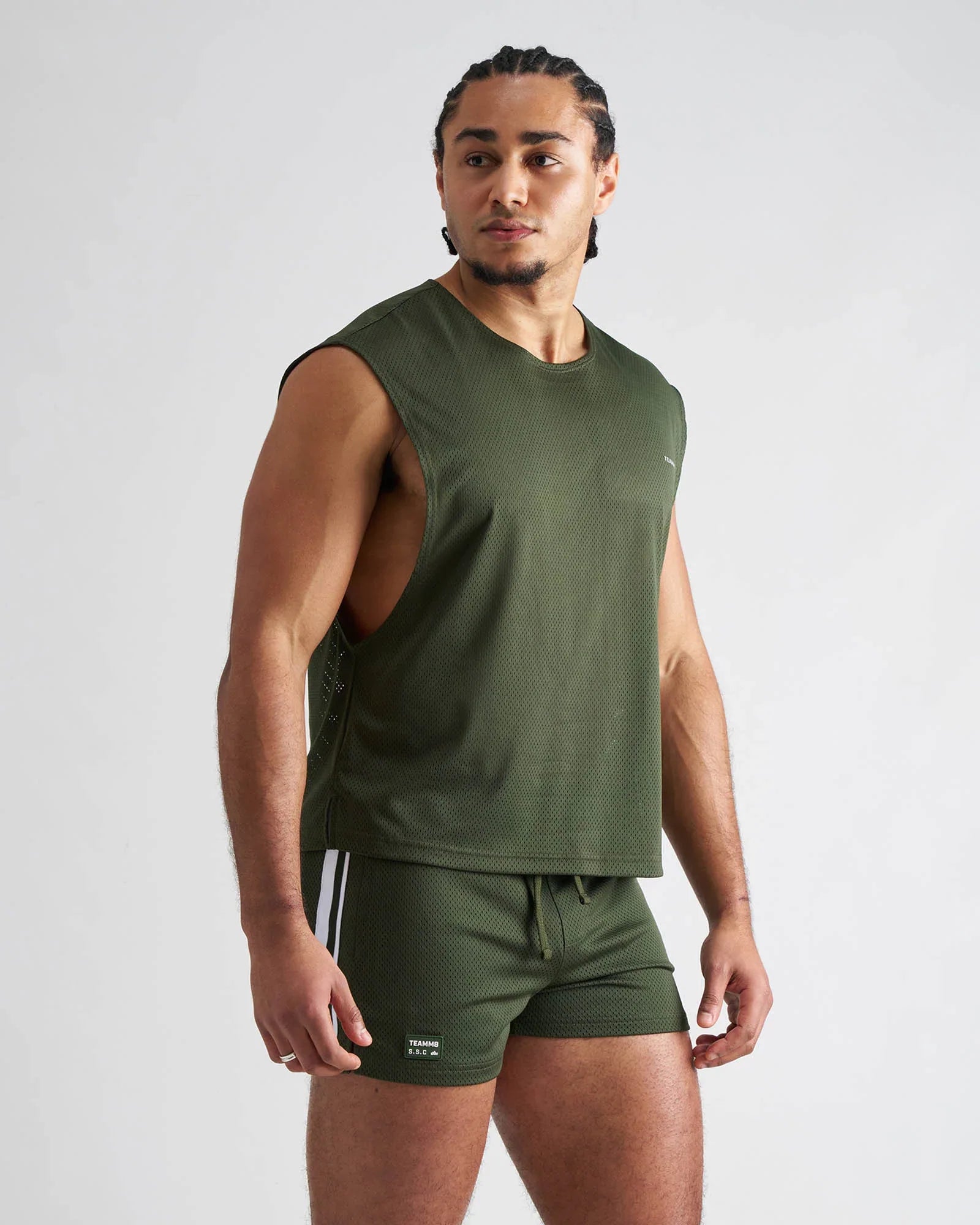 Olive green sleeveless athletic tank top with mesh fabric designed for breathable performance and comfort