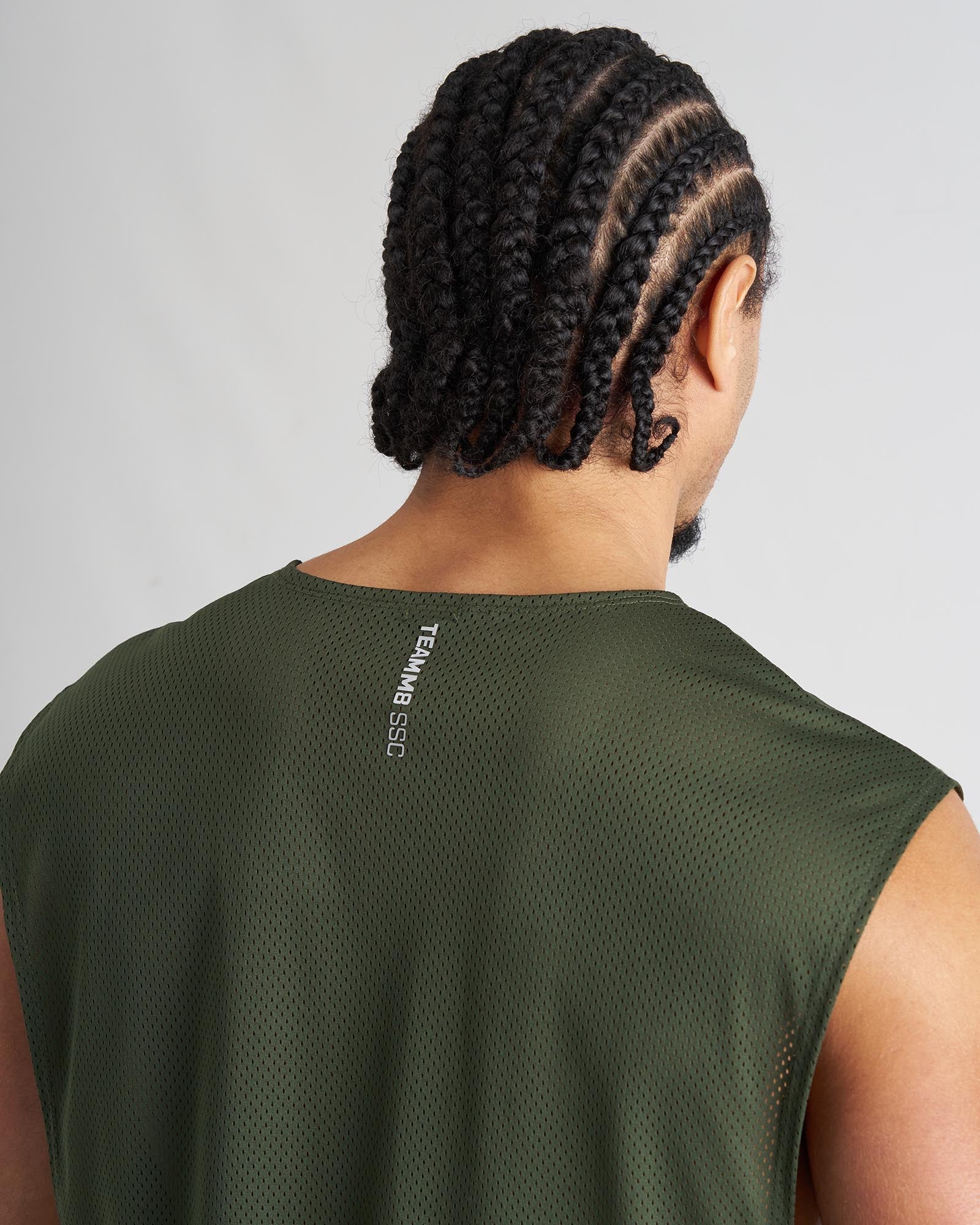 Back view of olive green mesh s.s.c. muscle tank with teammb ssg branding on the neckband