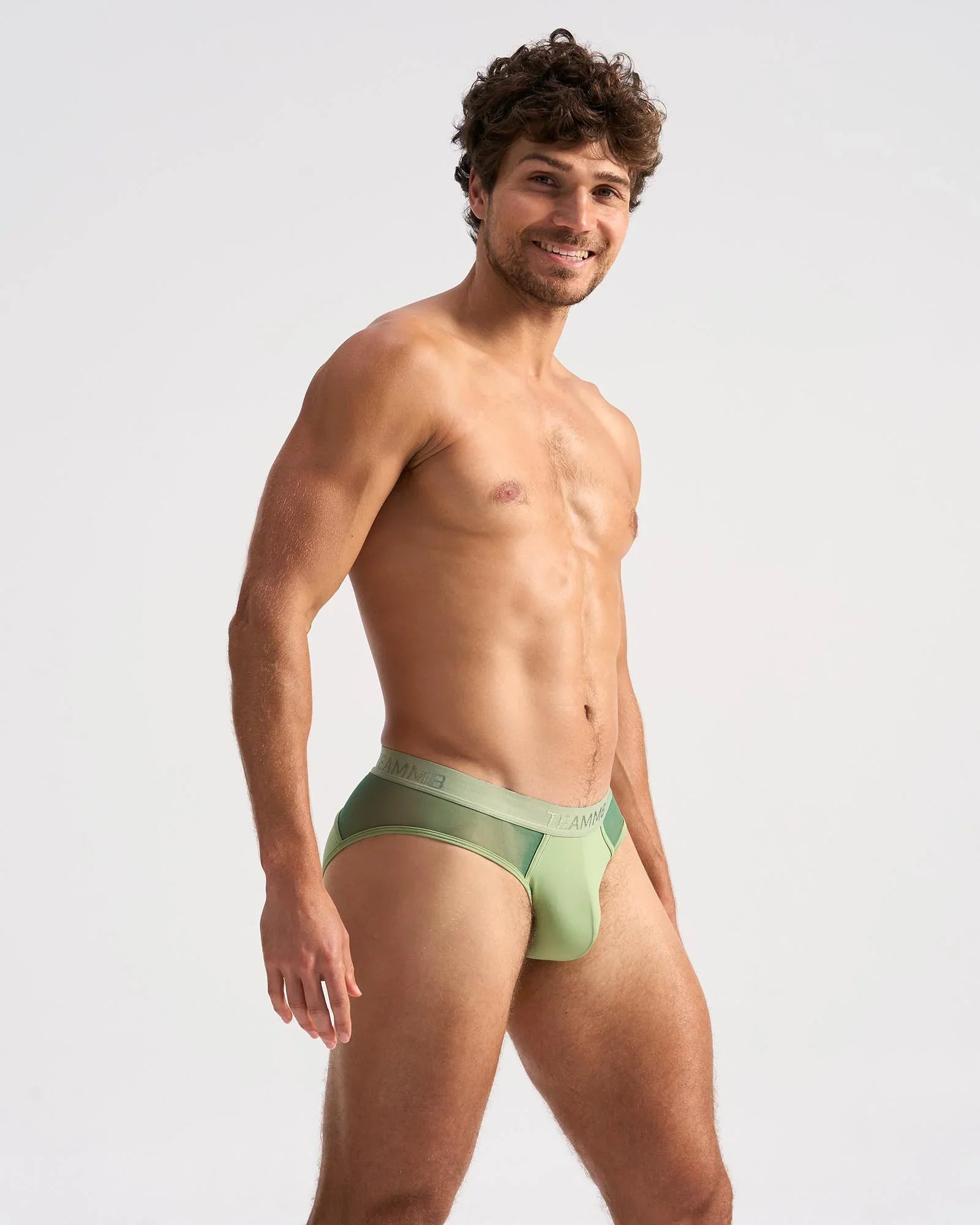 Light green score sheer brief with seamless design, subtle mesh side panel, and elastic waistband for comfort