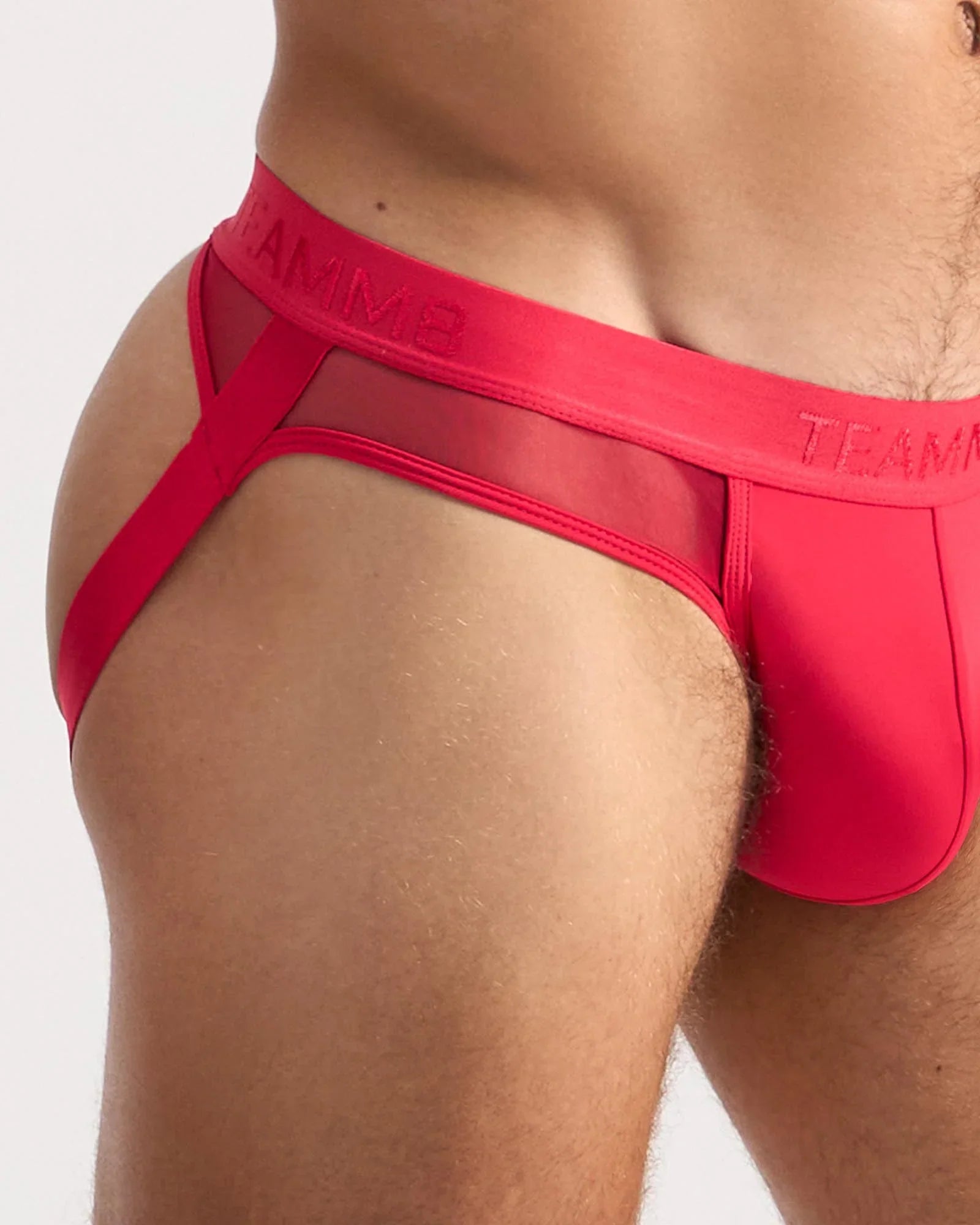 Vibrant red score sheer jock briefs with sheer mesh trim and bold elastic waistband featuring team logo
