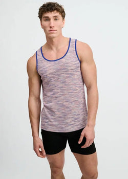 A male model wearing a purple ST33LE space dye textured knit tank top with blue trim, and black shorts.