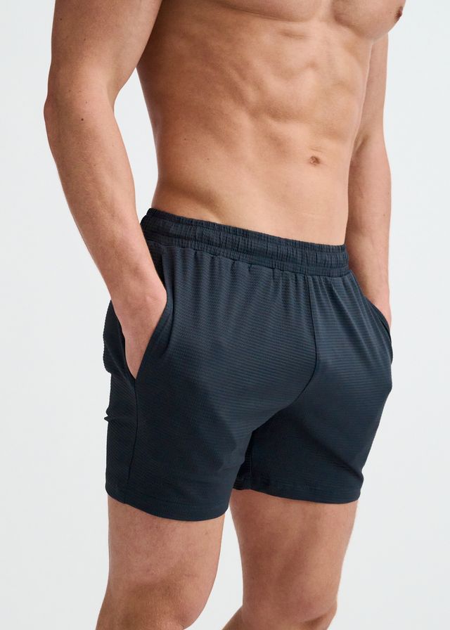 ST33LE textured mesh performance shorts in dark gray, featuring an elastic waistband and side pockets.