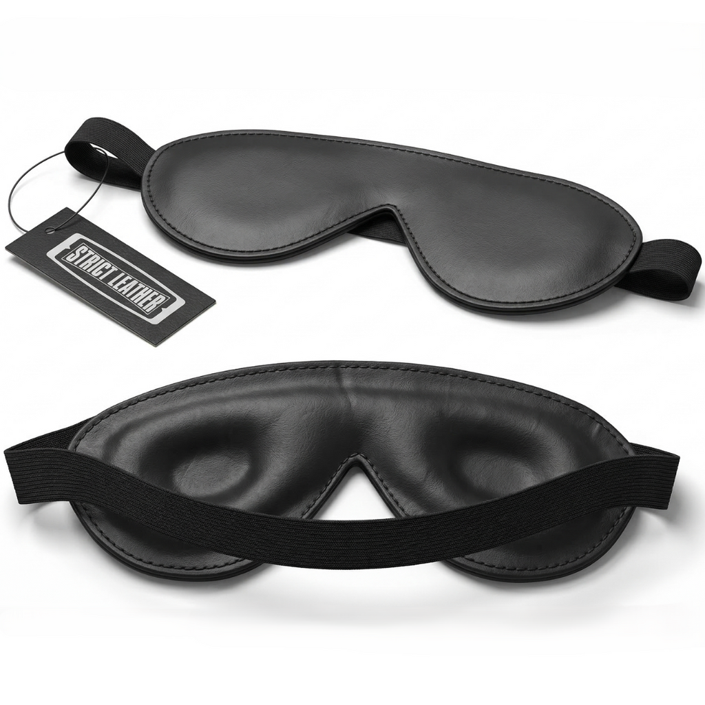 Strict Leather Padded Blindfold: Two black leather, contoured sleep masks with elastic headbands and a branded tag.