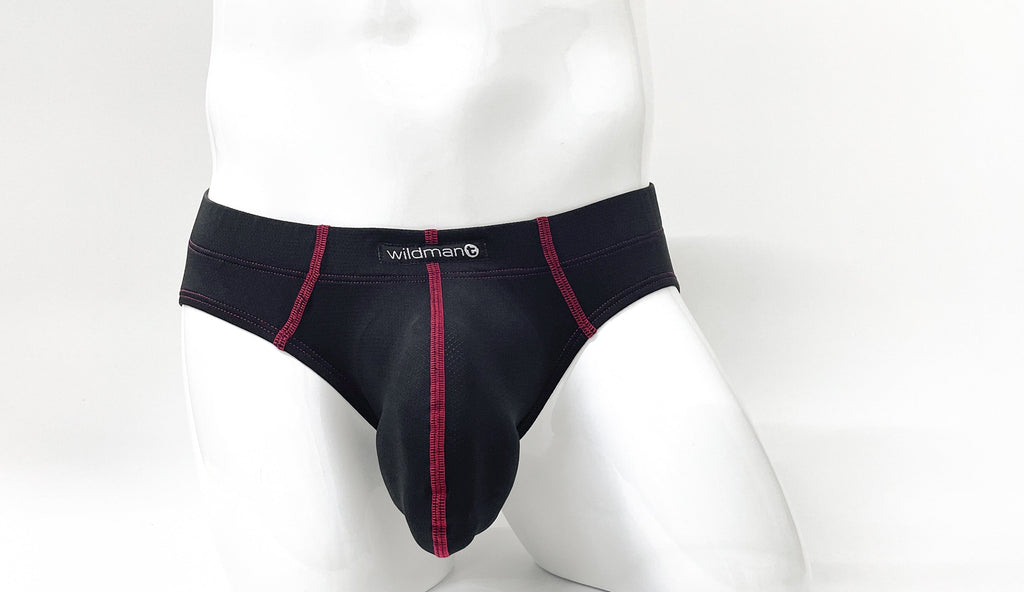 Stitch Big Boy Pouch Brief in black with red contrast stitching and a WildmanT logo on a white mannequin.