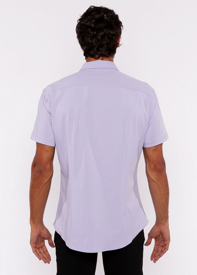 A man wearing a lavender stretch knit shirt with a classic collar and tailored fit in short sleeves
