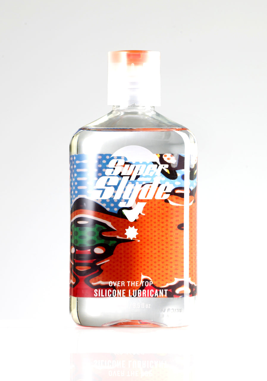 Clear plastic bottle of superslyde silicone lubricant with vibrant orange red and blue label for smooth use