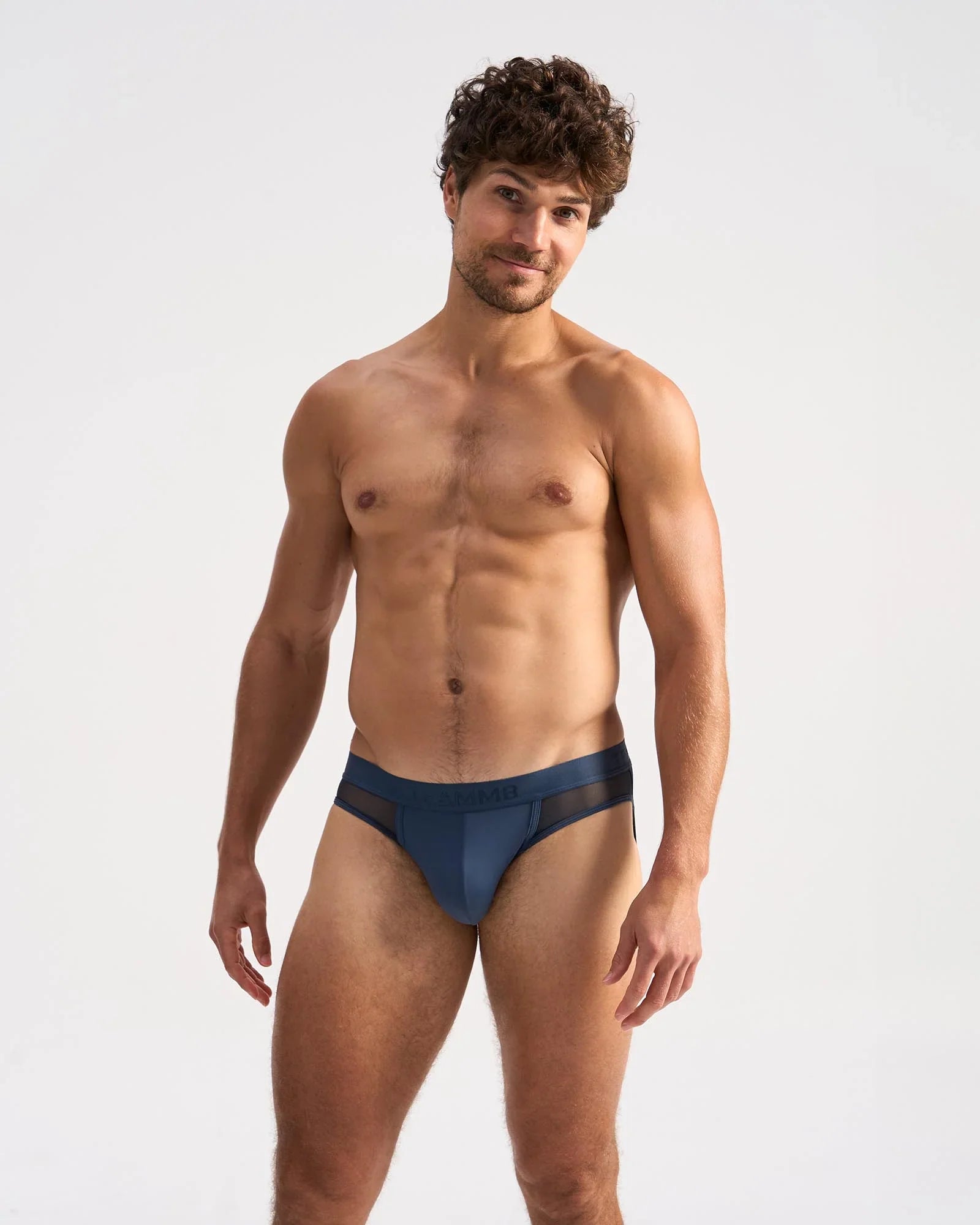 Navy blue score sheer jock briefs with a sheer mesh panel at the waistband showing the front side