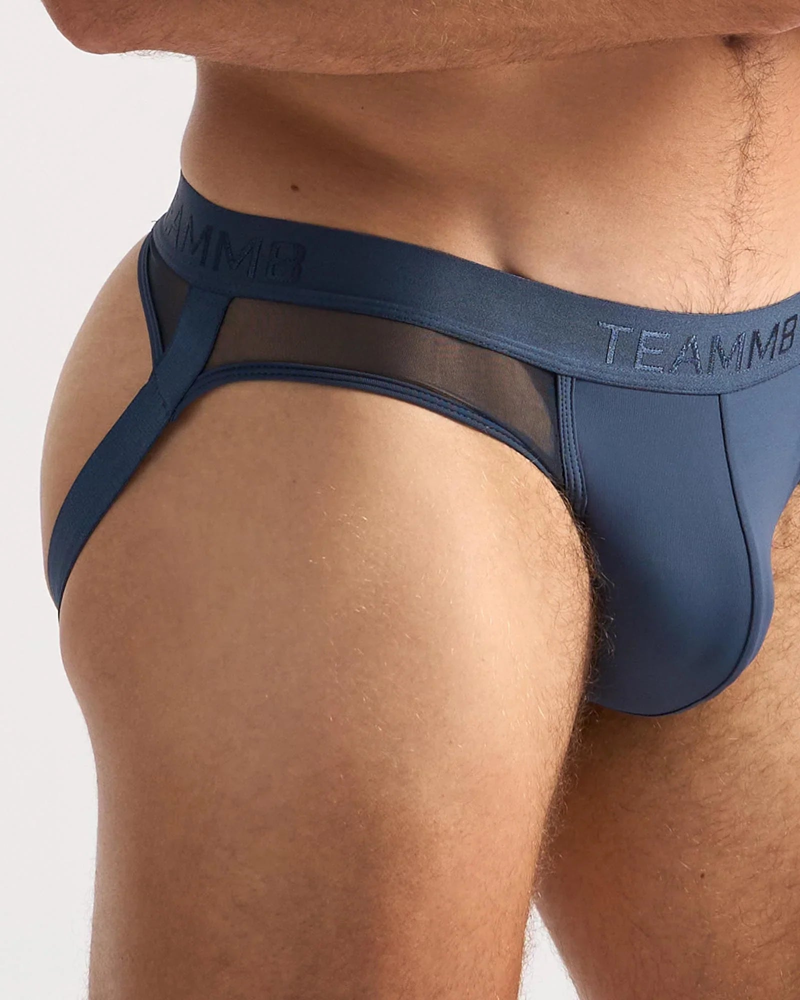 Blue teammb score sheer jock briefs with mesh panel and solid fabric construction shown from the back side