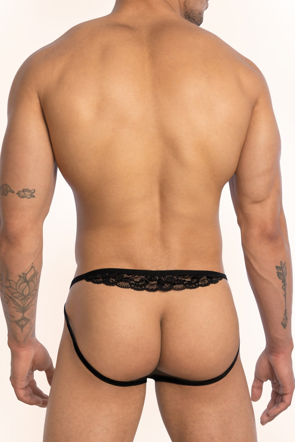 Black lace Secret Male SMC013 bikini brief thong with an intricate pattern along the waistband
