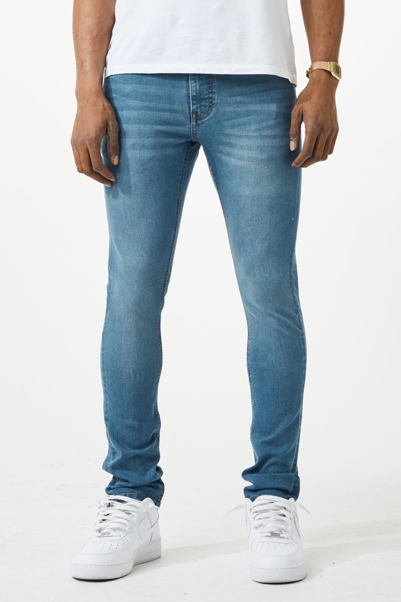 Blue slim fit denim jeans with subtle fading made of durable material for a stylish skinny fit look