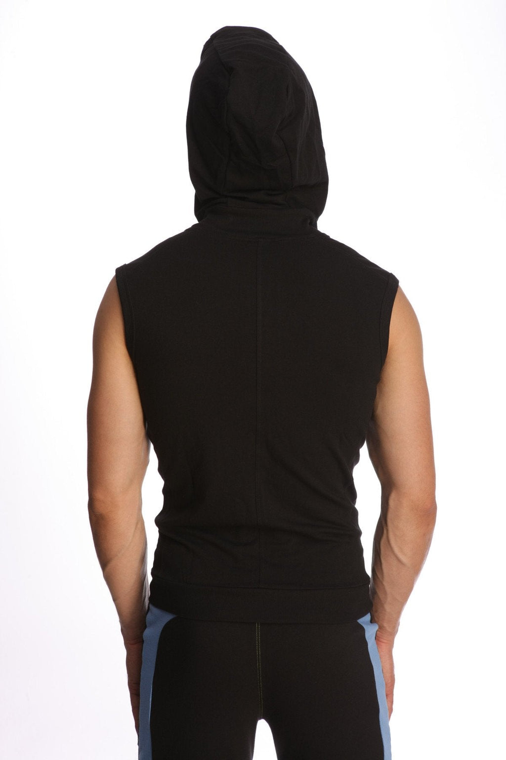 Black sleeveless yoga hoodie with snug fit and hood made from breathable material worn by a person