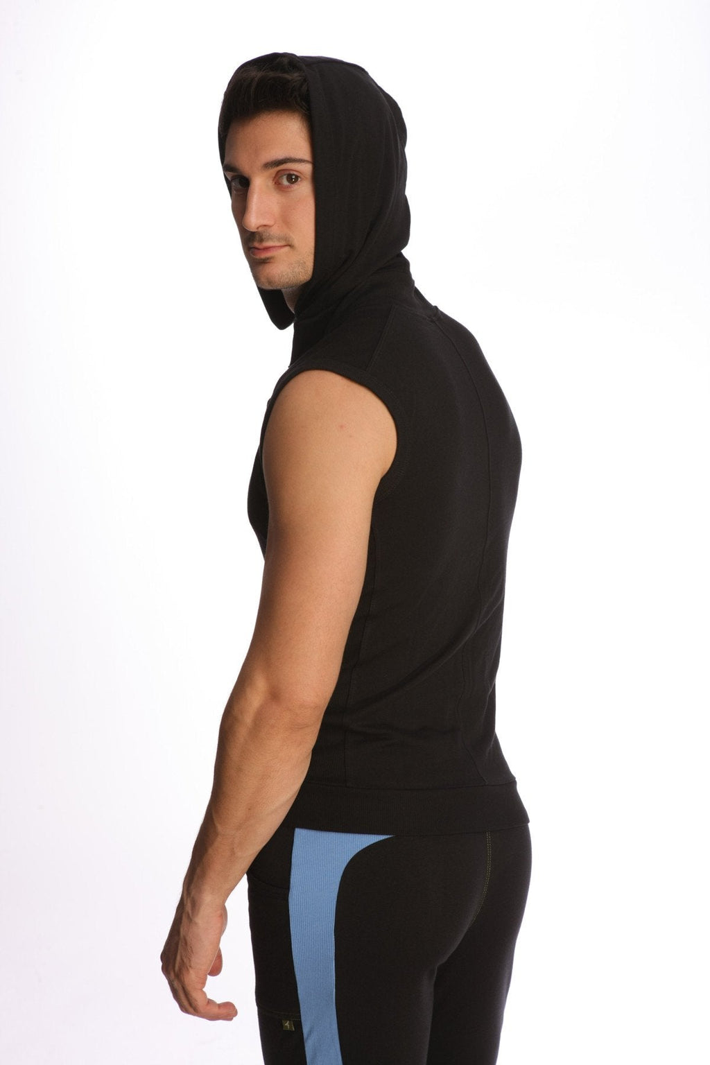 Black sleeveless yoga hoodie with hood paired with pants featuring subtle blue side paneling viewed from front