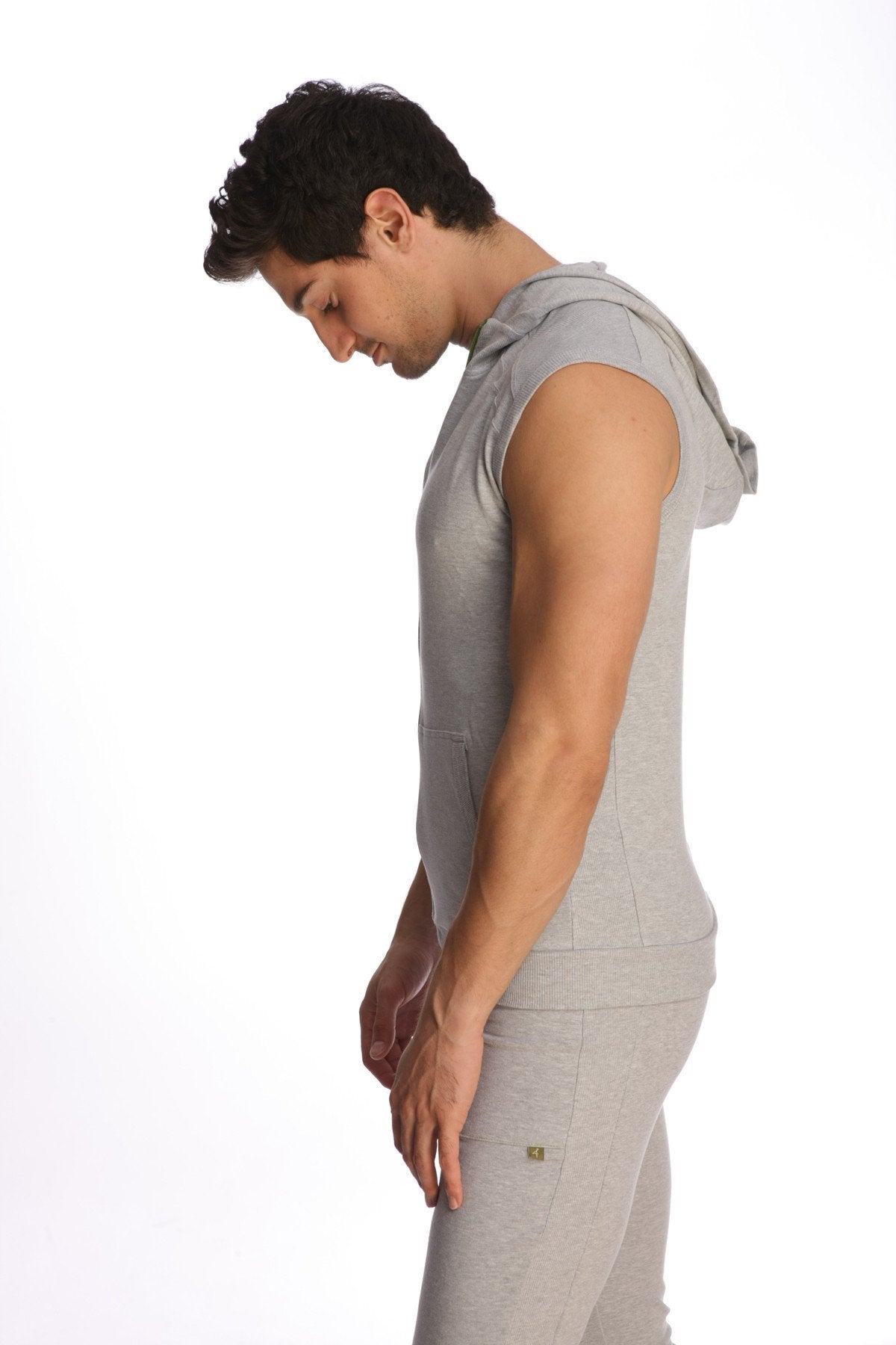 Gray sleeveless yoga hoodie with hood and front pocket made of soft fabric for comfortable activewear use