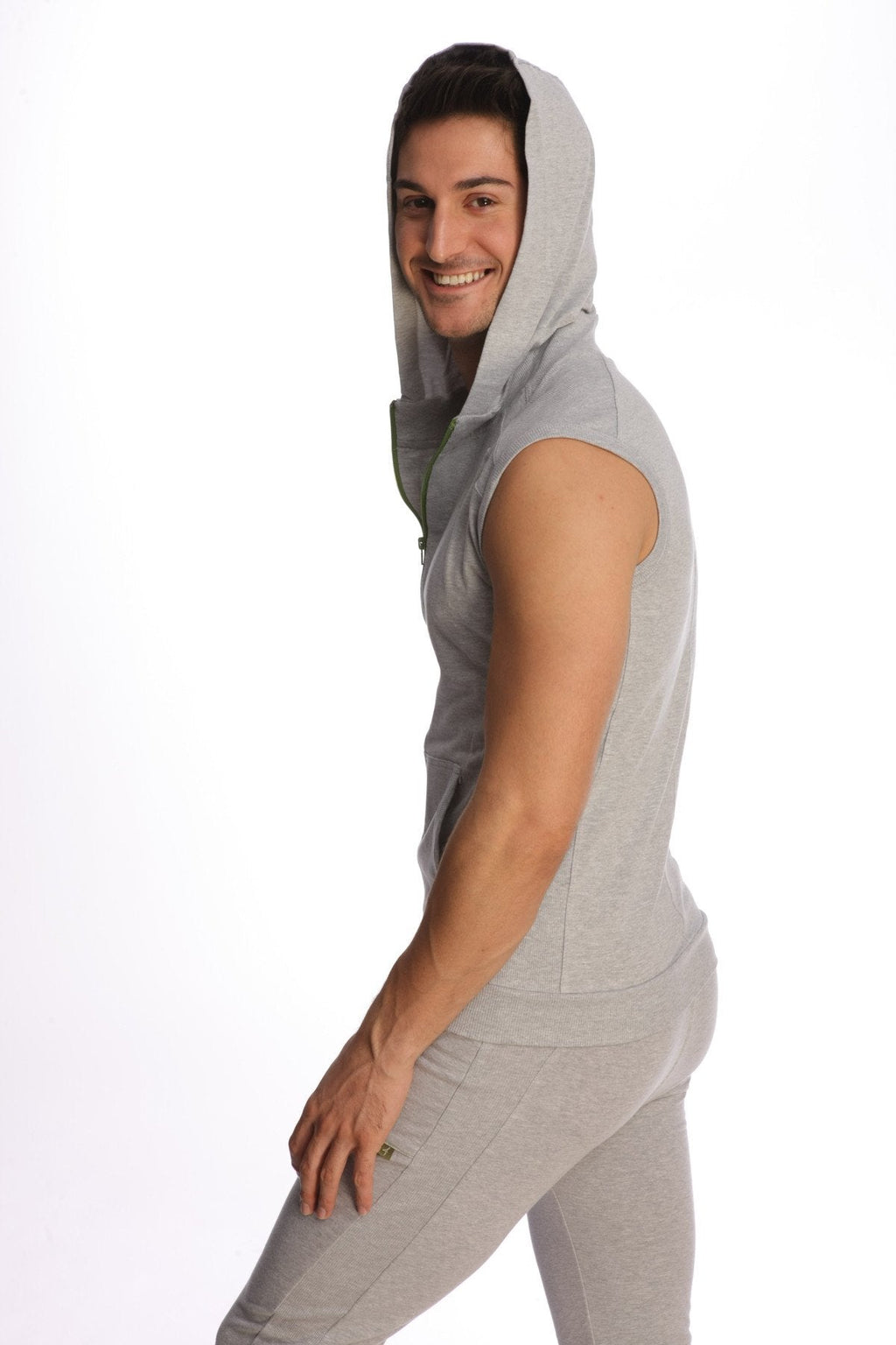 A light gray sleeveless yoga hoodie with a hood and front zipper made of soft fabric for comfortable workouts