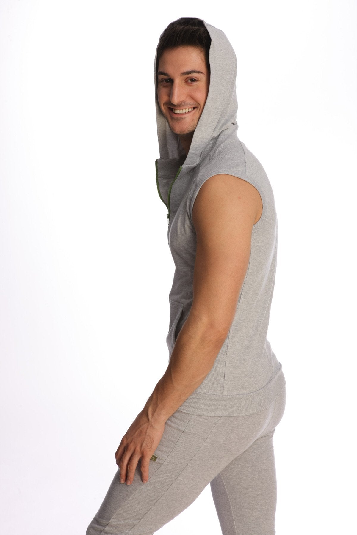 A light gray sleeveless yoga hoodie with a hood and front zipper made of soft fabric for comfortable workouts