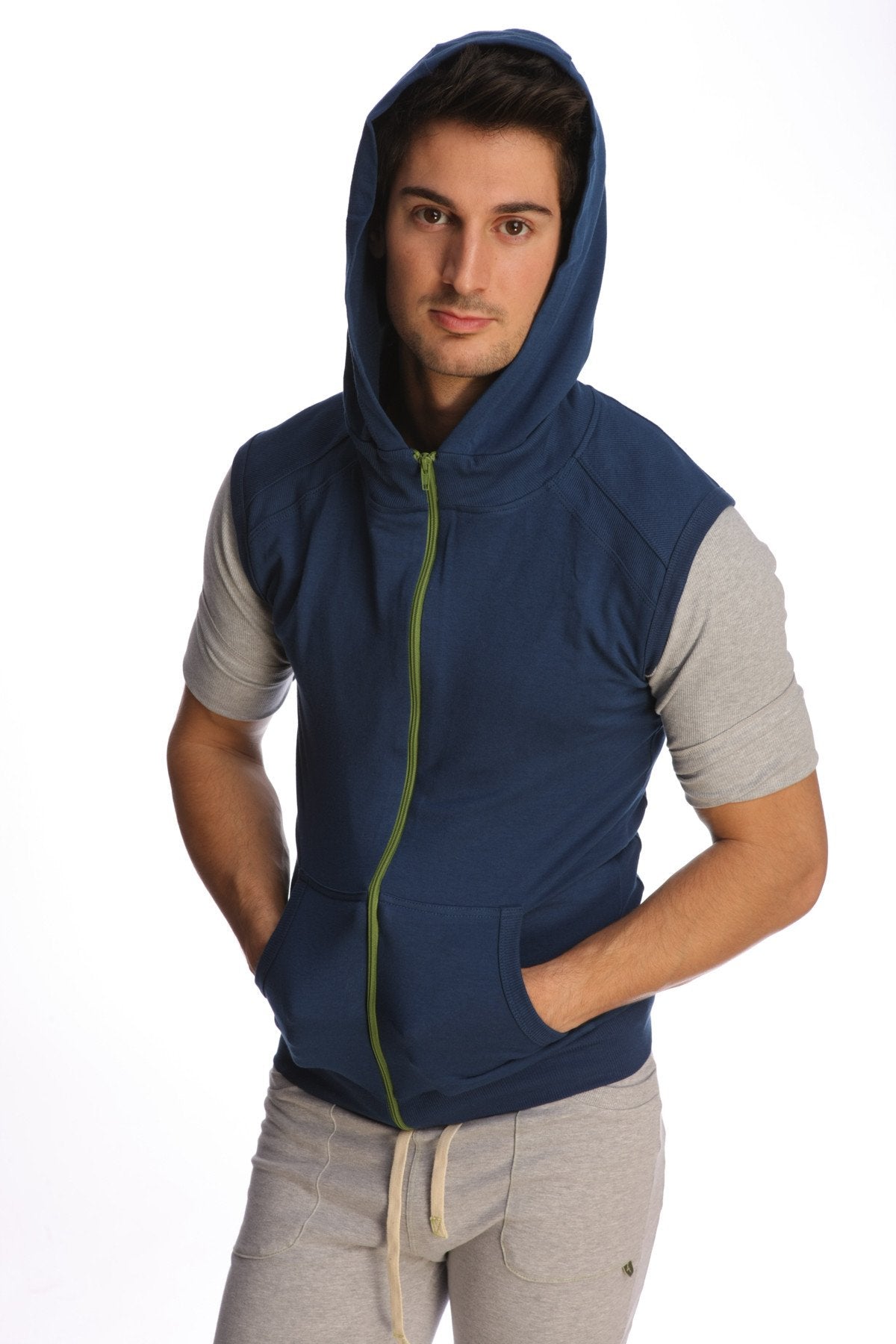 Navy blue sleeveless yoga hoodie with lime green zipper and gray short sleeves designed for active wear
