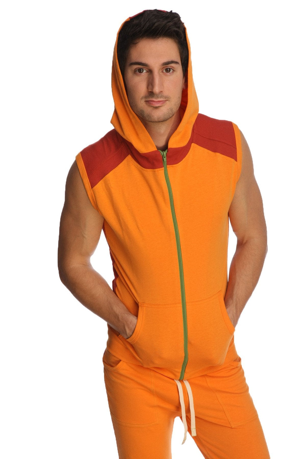 Sleeveless yoga hoodie in sun orange with red accents green zipper and drawstring pants for active wear